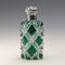 Antique British silver-lidded green cut glass portable perfume bottle